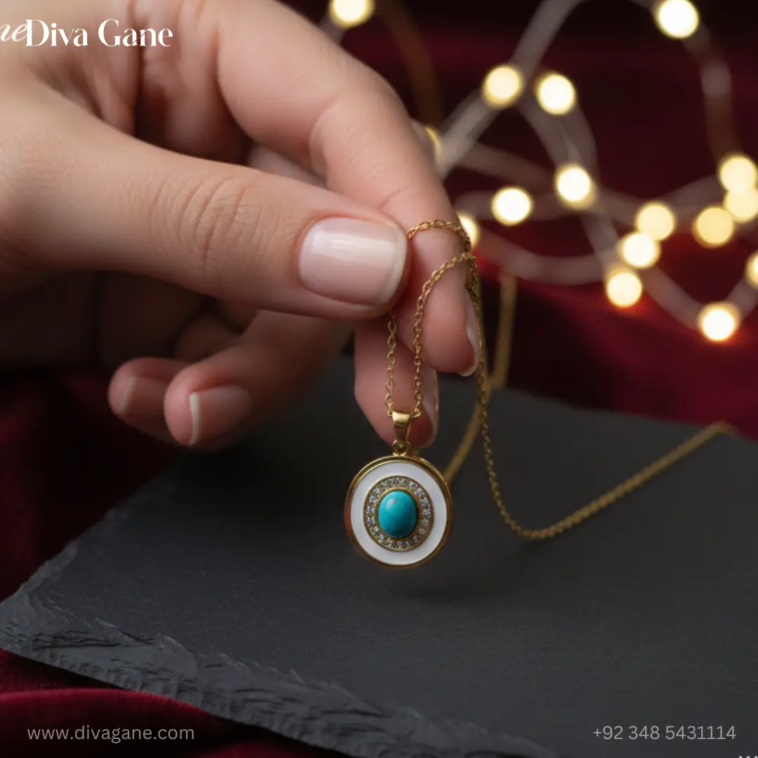 celestial turquoise evil eye medallion – white enamel & gold Luxury gold pendant necklace with a turquoise stone and white enamel finish, perfect for layering, shown with soft bokeh lighting