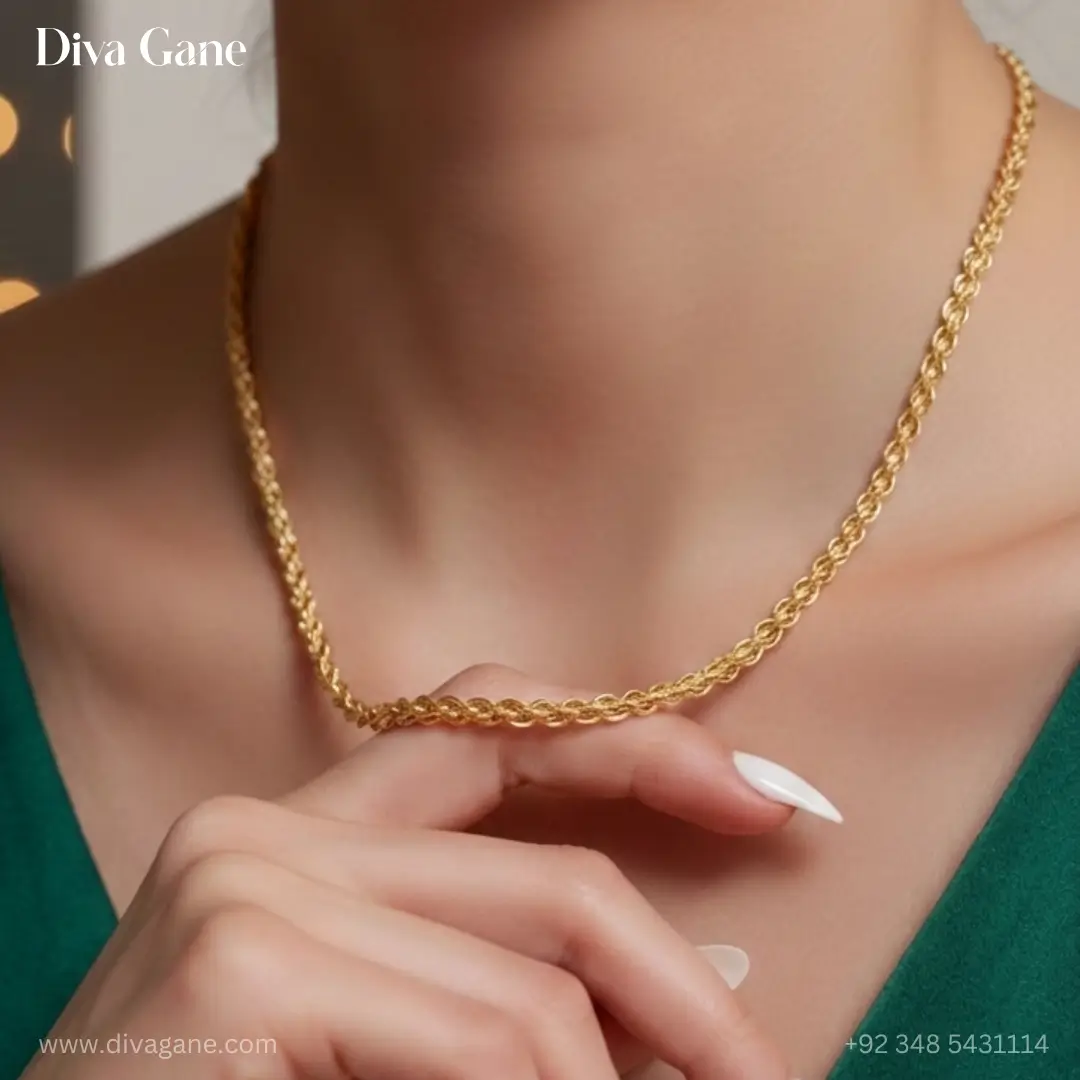 luxe minimalist flat link chain Close-up of a woman's neck wearing a thick 18K gold-plated rope chain necklace paired with a professional black blazer